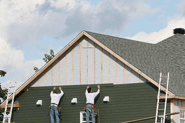 Professional Siding technician working in Seville, FL